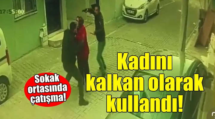 İzmir de sokak ortasında çatışma... Kadını kalkan olarak kullandı!