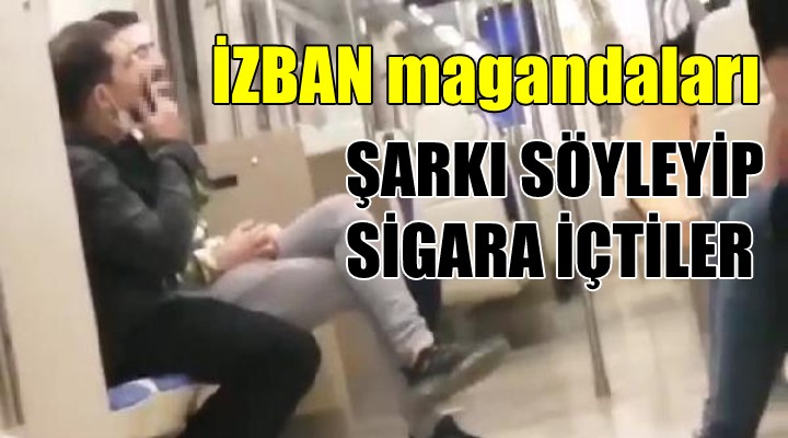 İZBAN magandaları... Şarkı söyleyip sigara içtiler!