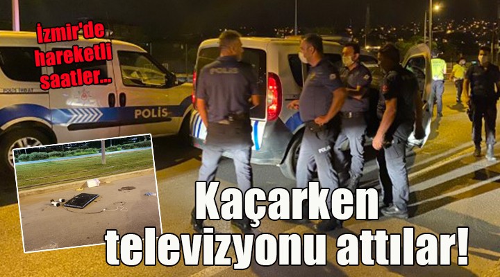 İzmir de hareketli saatler... Kaçarken televizyonu arabadan attılar!