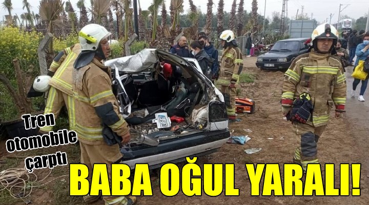 Tren otomobile çarptı: Baba oğul yaralı!